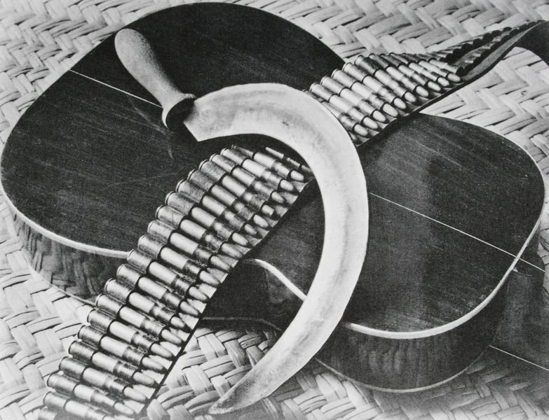 Sickle, Cartridge Belt, and Guitar