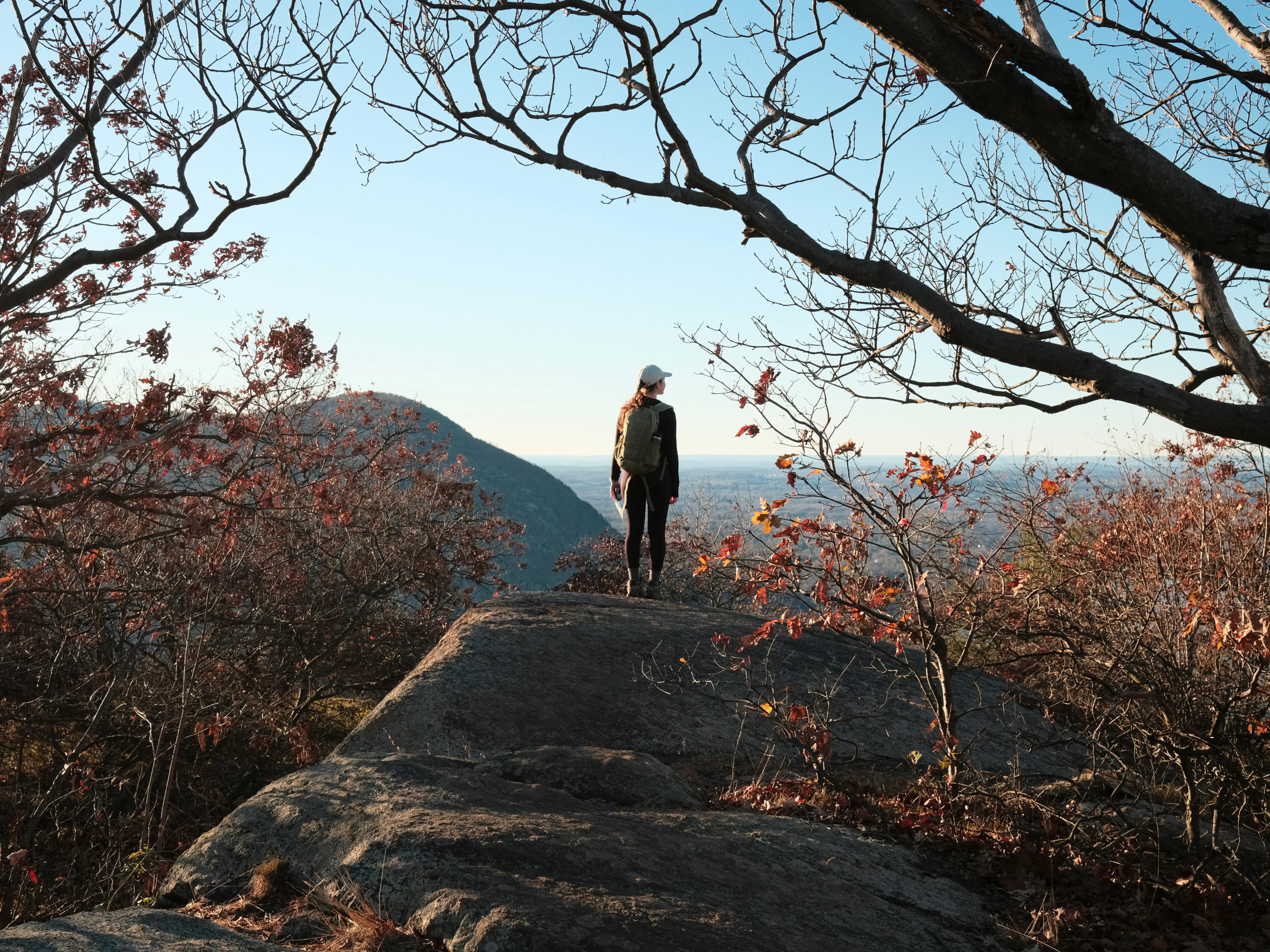 Photo: 2022-11-26_Laura-Standing-On-A-Rock.webp