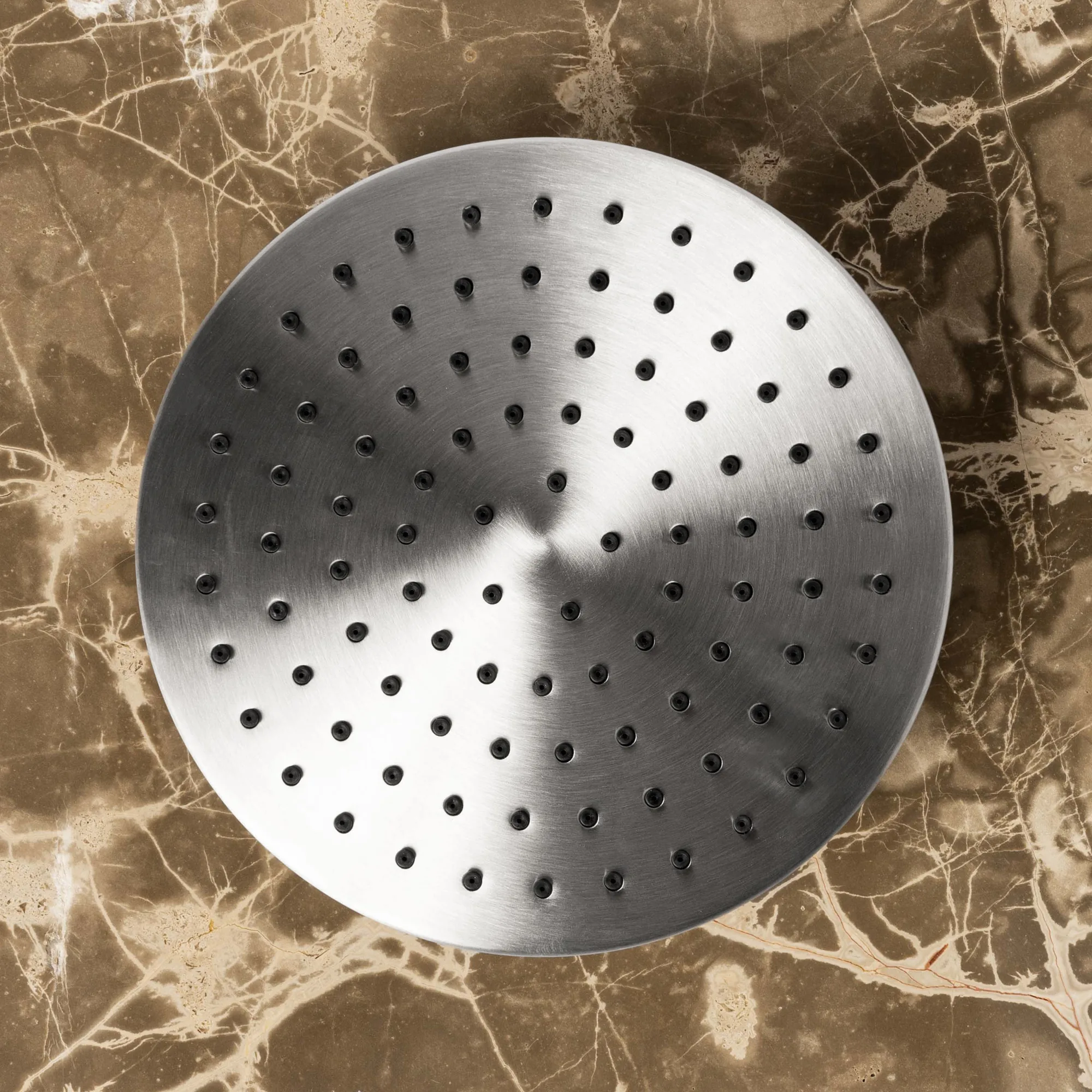 Tubico brushed stainless steel round rain shower head on marble
