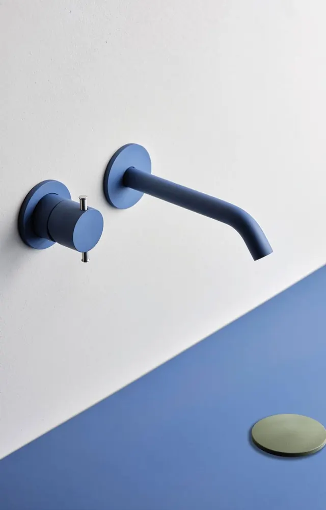 Fontea wall-mounted tap in sweet blue on a split blue backdrop