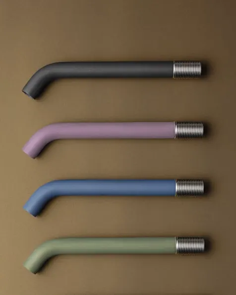 Four Fontea Tinta coloured spouts mounted on a wall