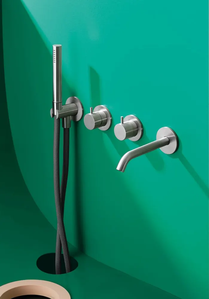 Fontea hand shower and wall controls in a green shower niche