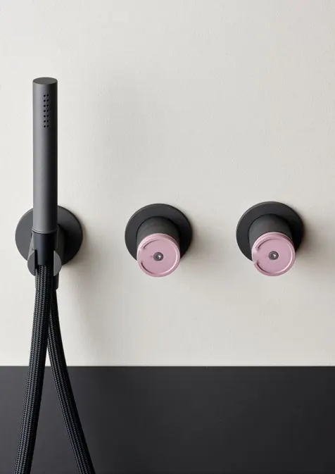 Fontea pearl black and light rose shower controls on a dark wall